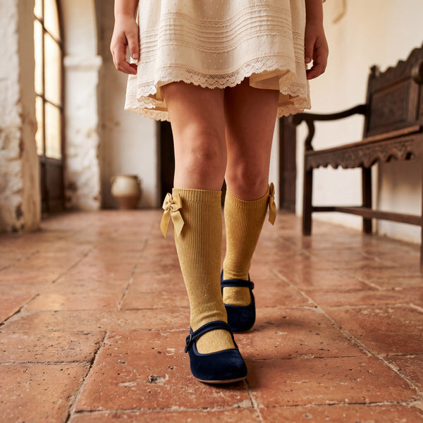 Girl Light Mustard High Socks with Side Bow — view 2 — handcrafted in Spain — AGÜ Baby