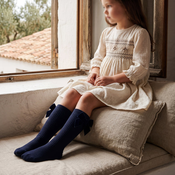 Girl Navy Blue High Socks with Side Velvet Bow — view 2 — handcrafted in Spain — AGÜ Baby