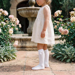 Girls White Perforated High Socks with Bow — view 2 — handcrafted in Spain — AGÜ Baby