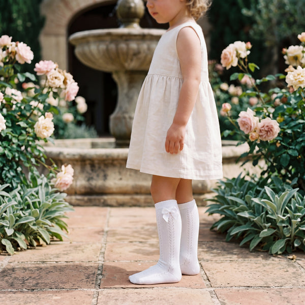 Girls White Perforated High Socks with Bow — view 2 — handcrafted in Spain — AGÜ Baby